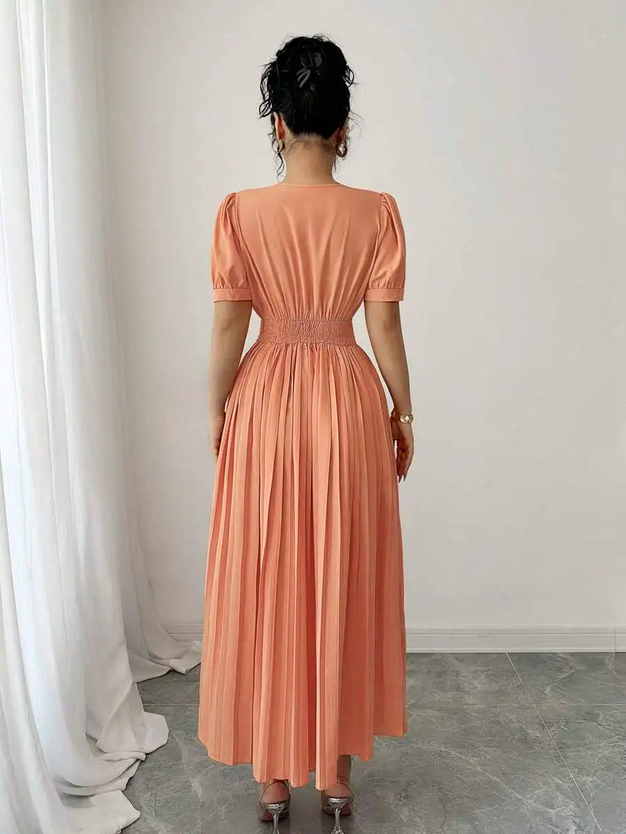 Peach Pleated A-Line Dress with V-Neck, Puffed Sleeves and Decorative Waist Belt